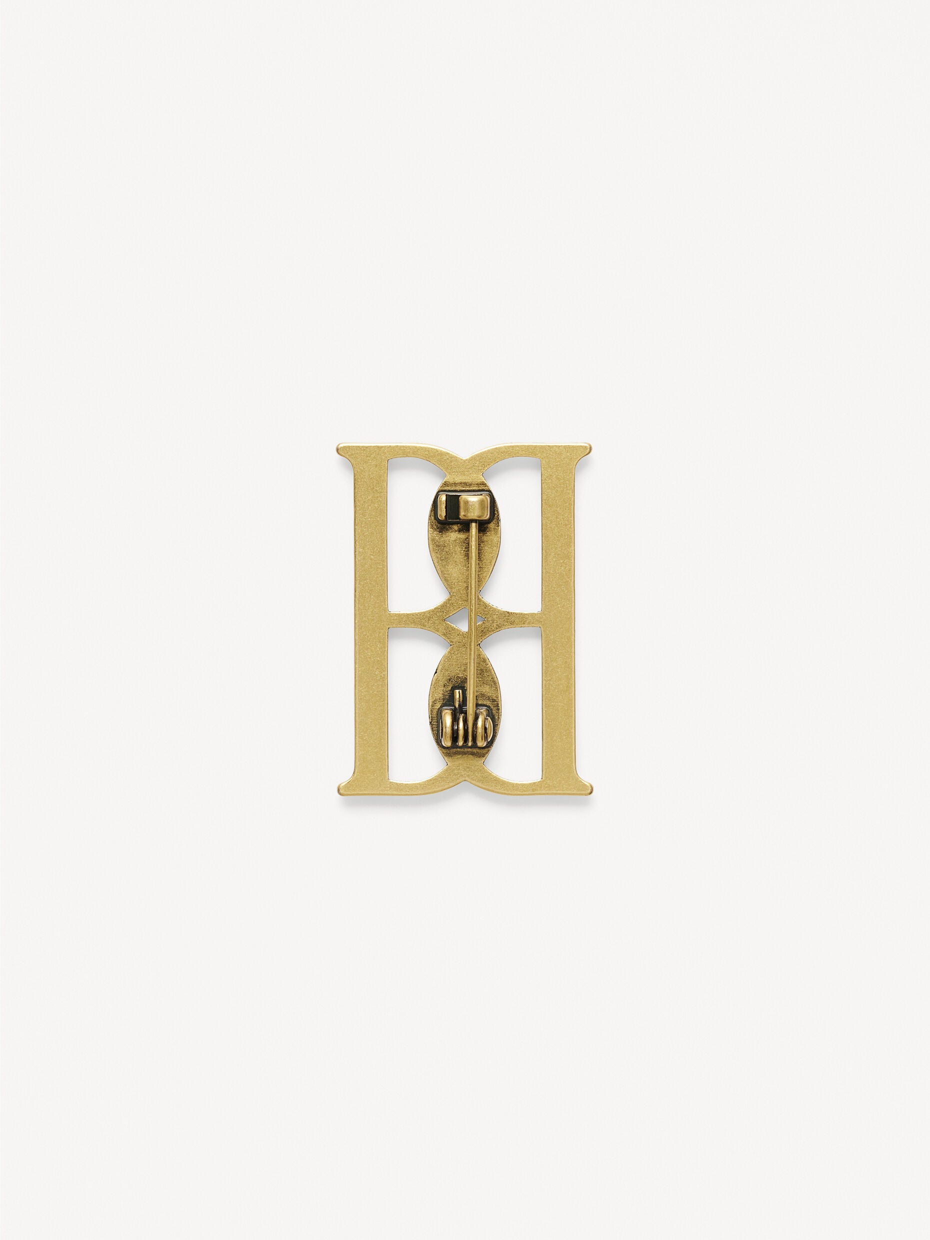Mono small gold-tone brooch