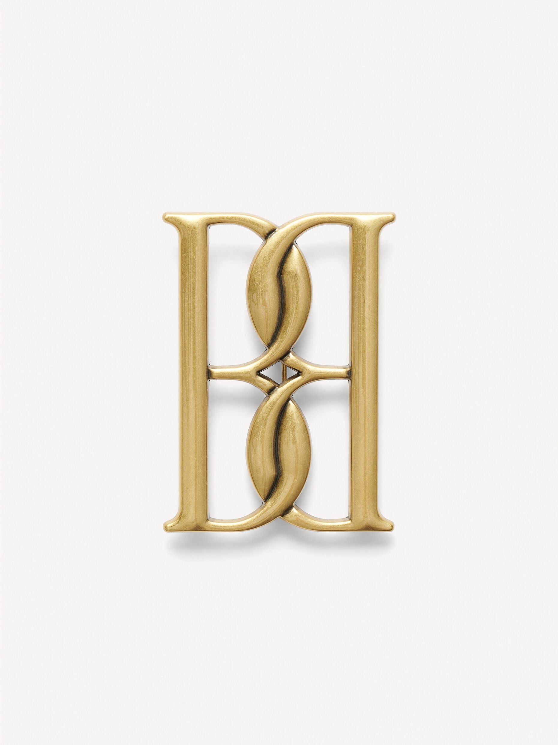 Mono large gold-tone brooch